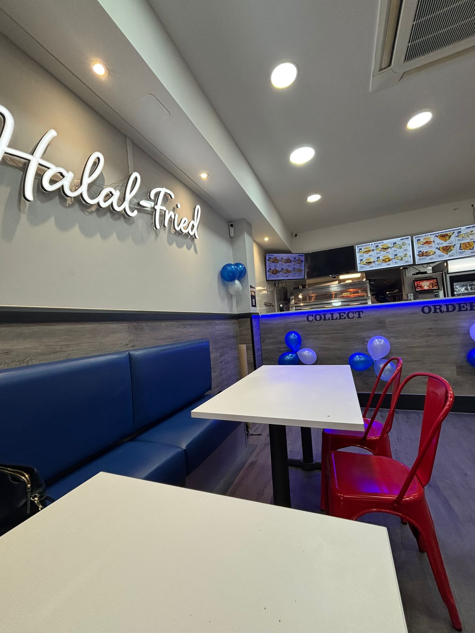 Completed commercial takeaway fit-out with seating and counter